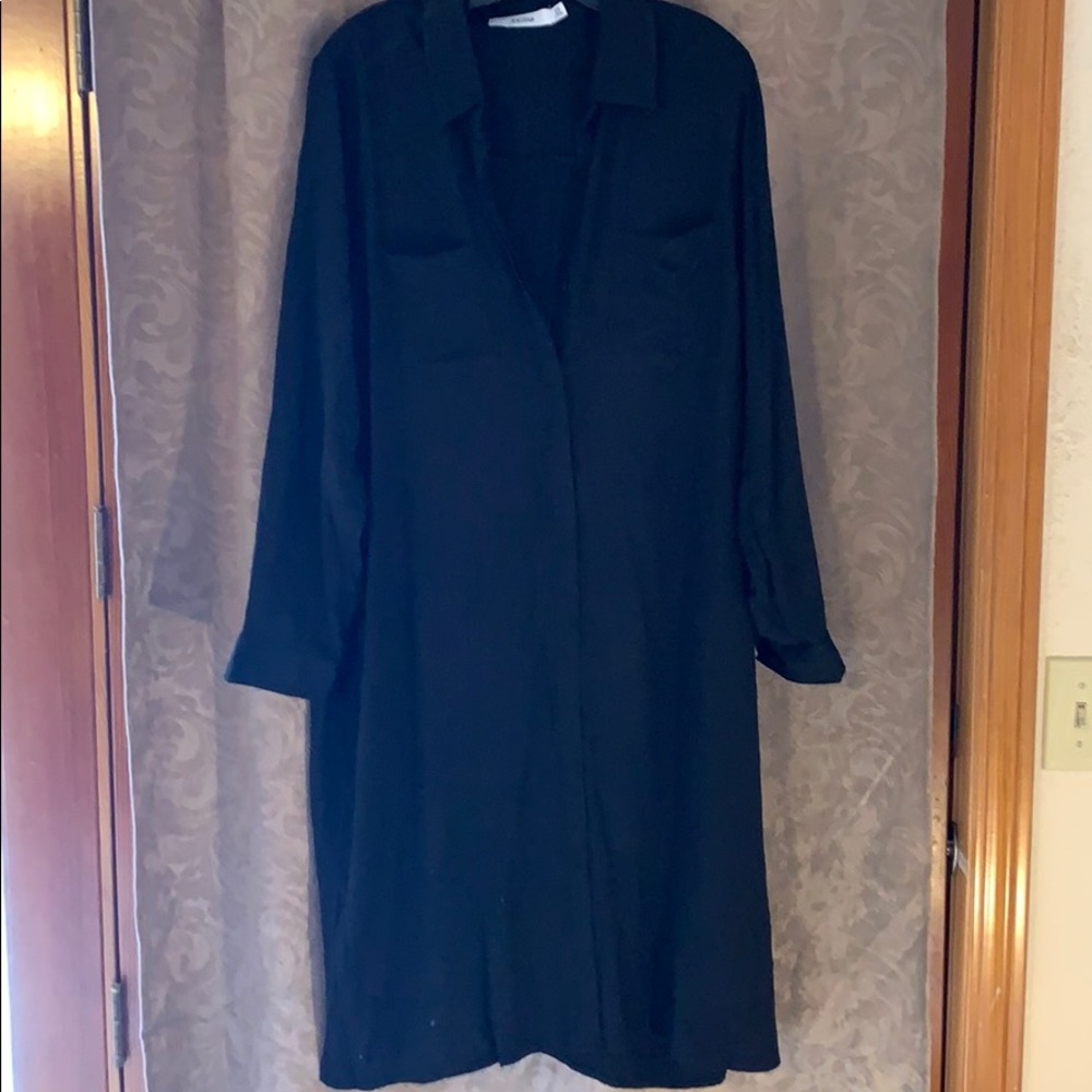 Long sleeved, button down dress.